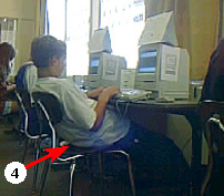 child sitting at computer table with arrow 4 pointing at gap between child's back and the back of the seat